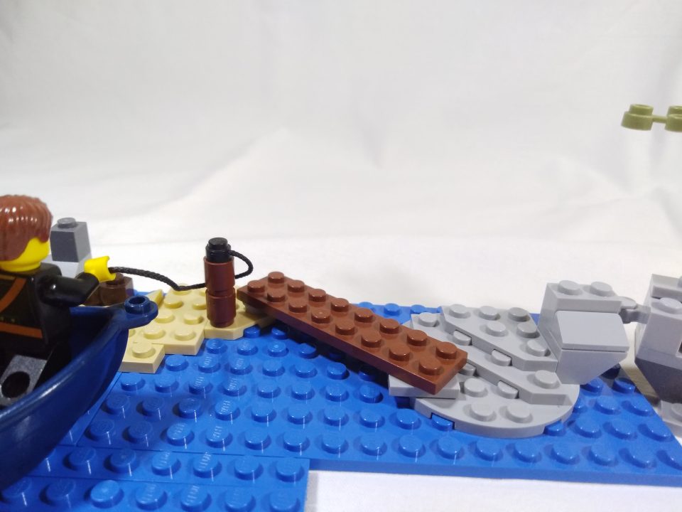 A LEGO Pirate mooring a boat