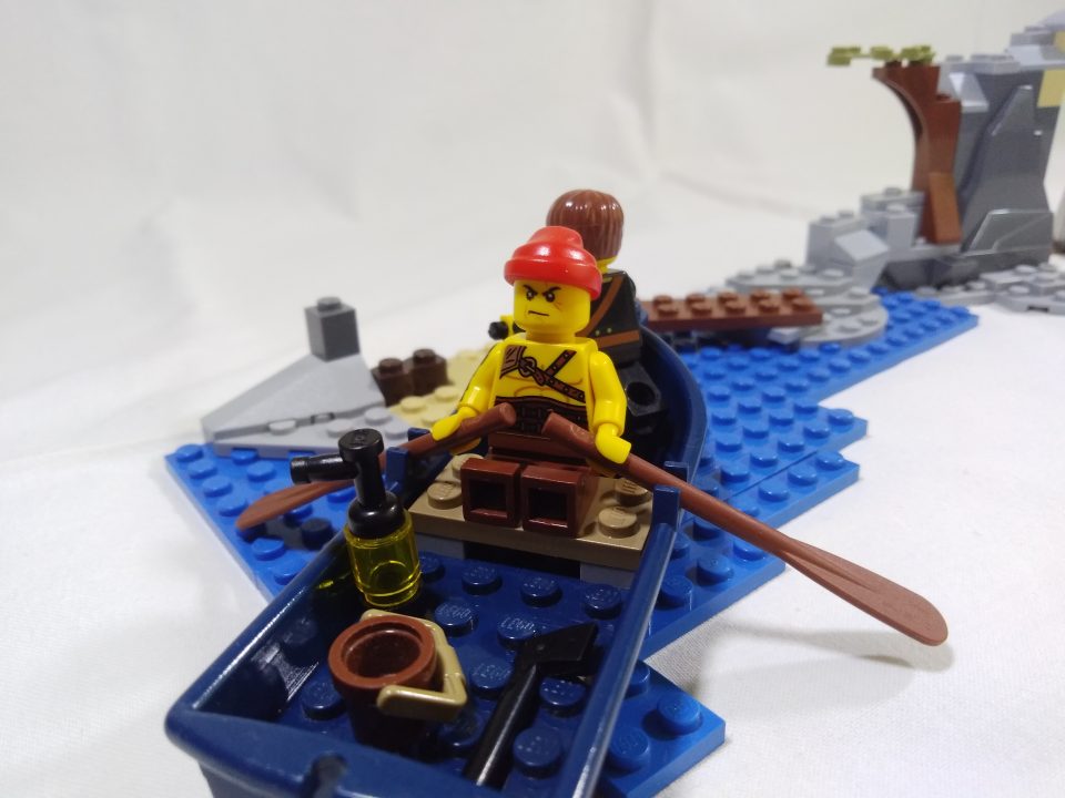 Two LEGO Pirates minifigures in a boat