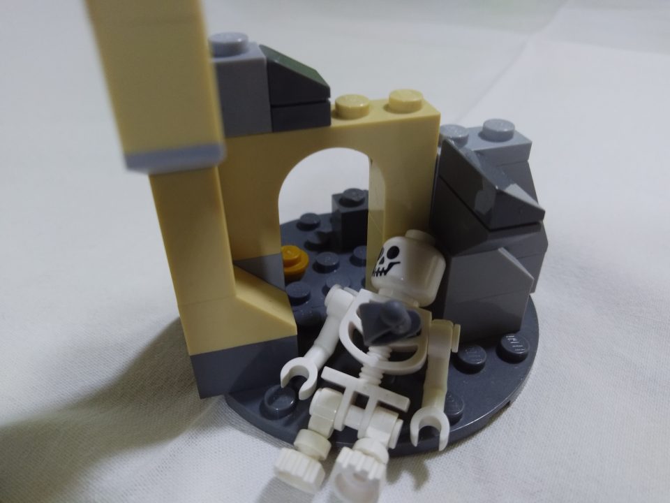 LEGO Pirate Skeleton stabbed by cutlass