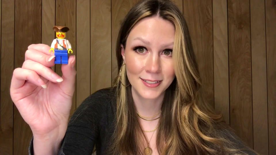 Stacy of For Bricks And Giggles holding Steve minifigure