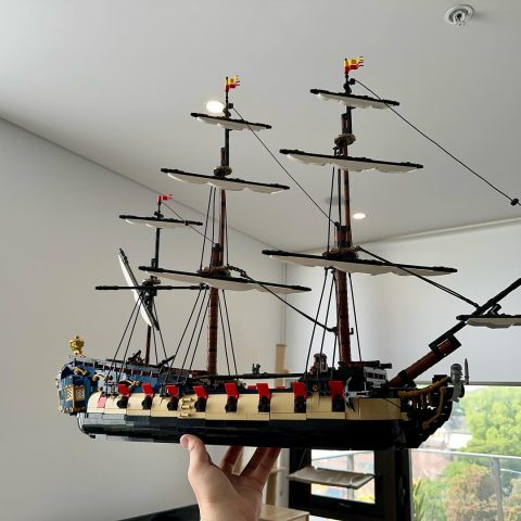 Holding “Privateer Frigate Fortuna” in a single hand