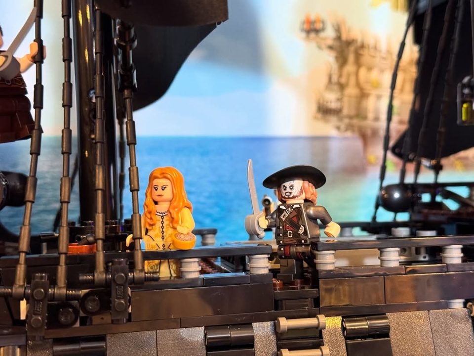 Elizabeth Swann and Captain Barbossa minifigs onboard LEGO Icons 10365 Captain Jack Sparrow's Pirate Ship