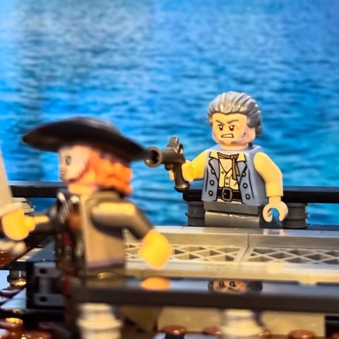 Gibbs minifig shooting Barbossa minifig onboard LEGO Icons 10365 Captain Jack Sparrows Pirate Ship