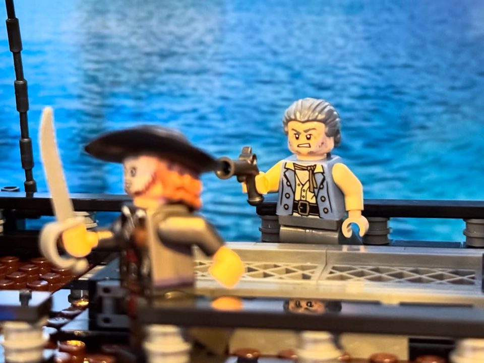 Gibbs minifig shooting Barbossa minifig onboard LEGO Icons 10365 Captain Jack Sparrows Pirate Ship