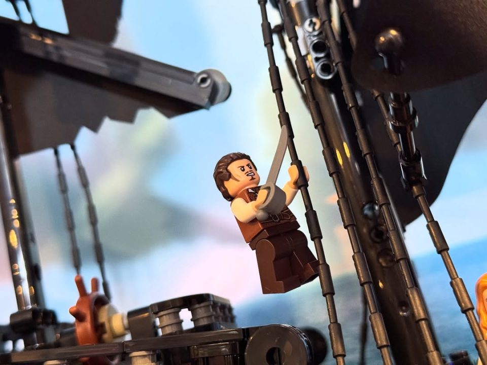 Will Turner minfig hanging from mast of LEGO Icons 10365 Captain Jack Sparrow's Pirate Ship