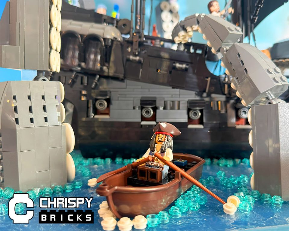 Jack Sparrow minifigure rowing away from 10365 Black Pearl wrapped in kraken's tentacles