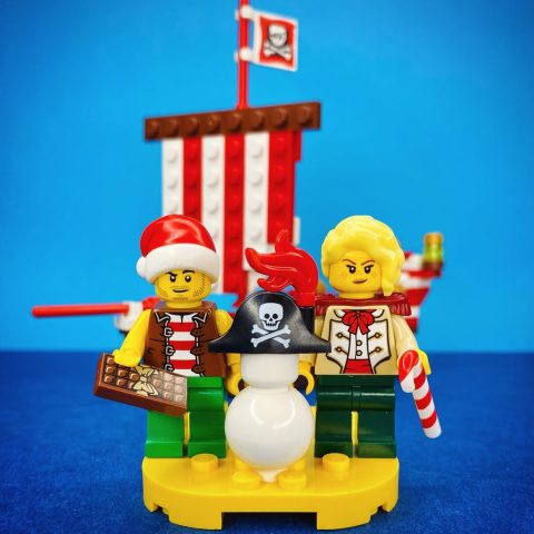 Bo’Sun Will and Camilla minifigures on island near “The Jolly Santa” by captain_brixx