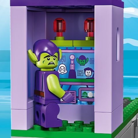 Green Goblin minifigure using a computer