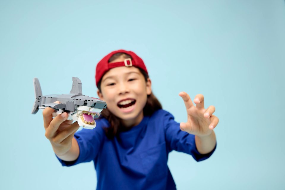 Click here to enlarge image Child playing with shark build from 31381 Fierce Shark with a Treasure Chest