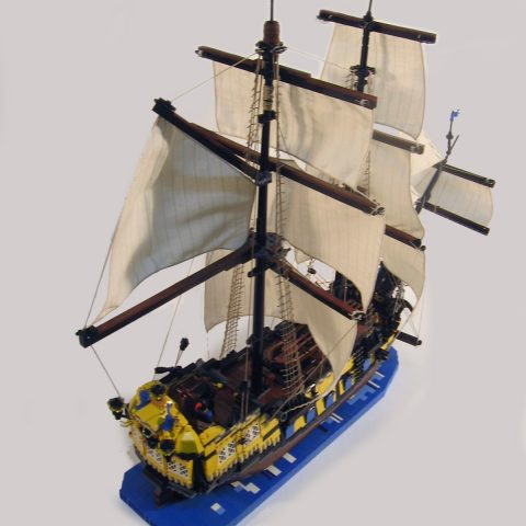 Sails of the ship docked at Port Royal from above